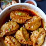 Six dumplings in a thick chilli sauce.