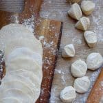 Freshly rolled dumpling wrappers and some dough pieces.