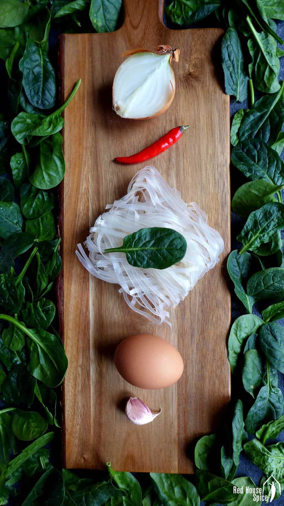 onion, chilli, rice noodles, egg, garlic and spinach