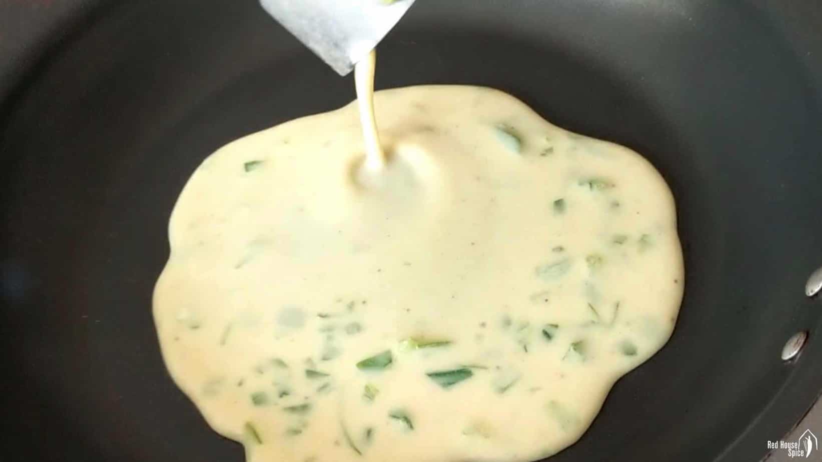 pouring batter into a pan