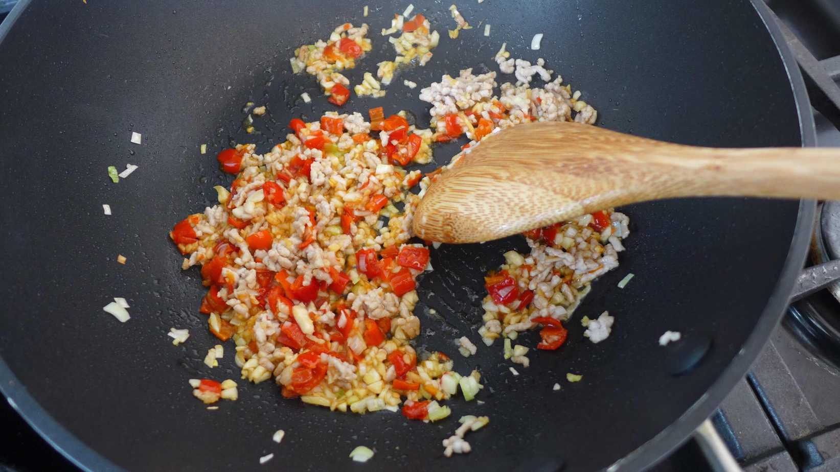Stir frying minced meat and pickled chilli