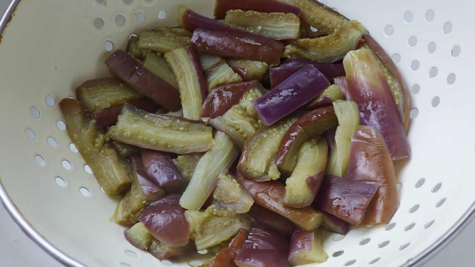 eggplant pieces in a colander