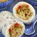 One Fan Tuan cut open showing the fillings with overlay text that says Chinese sticky rice roll.