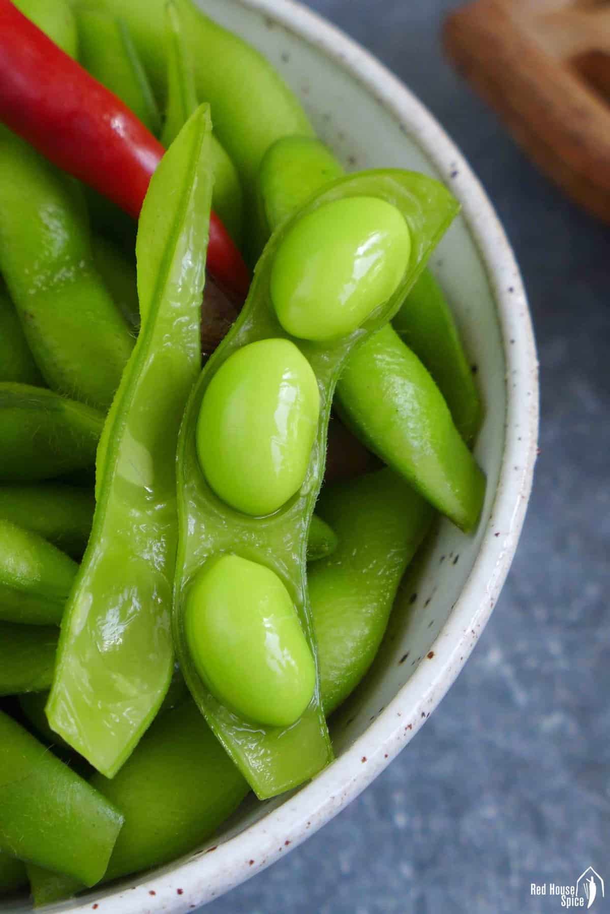 Chinese five spice edamame with pod open.