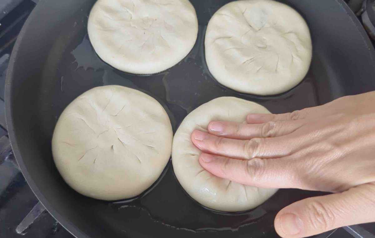 flattening a meat pie.