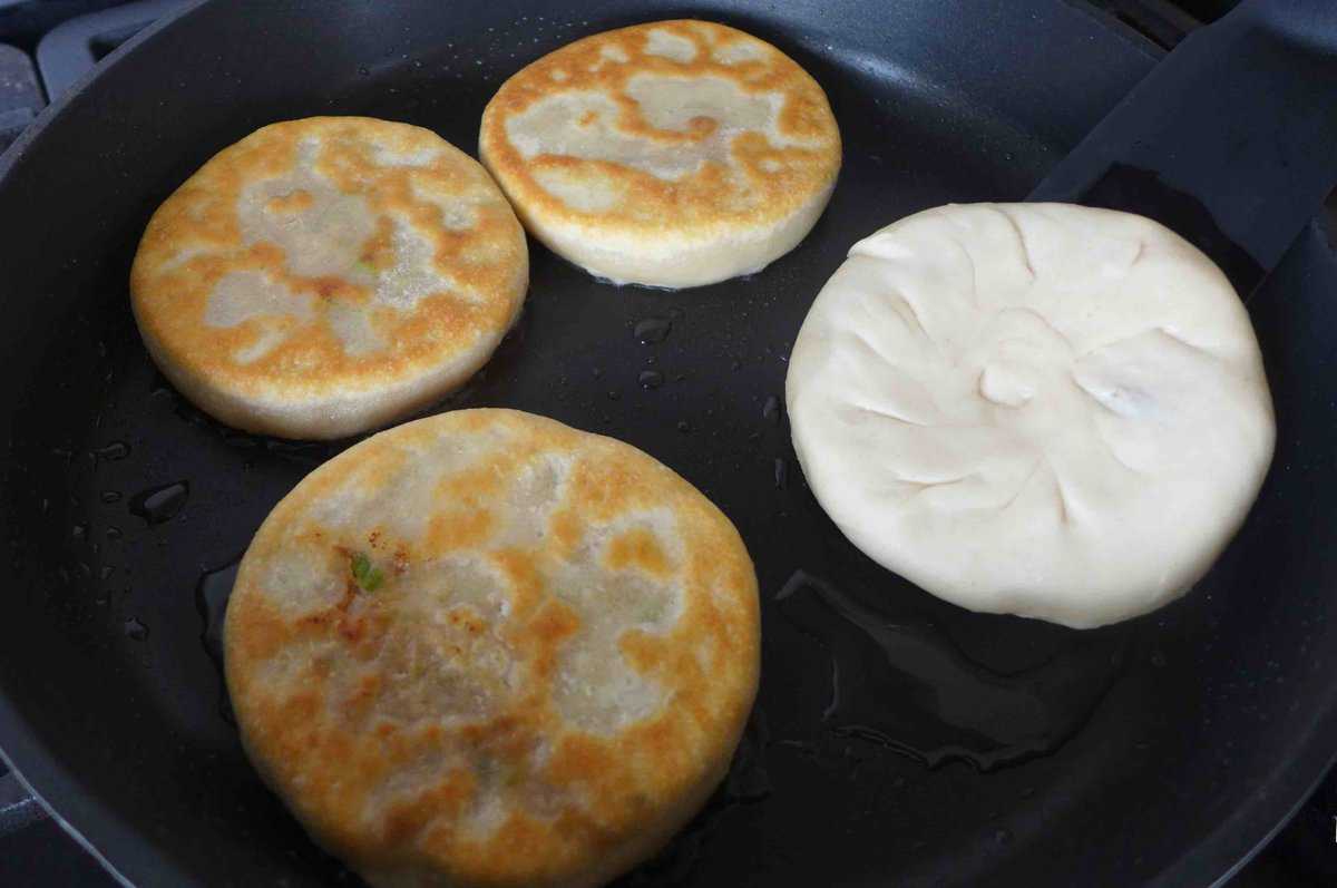 filling a chinese meat pie.