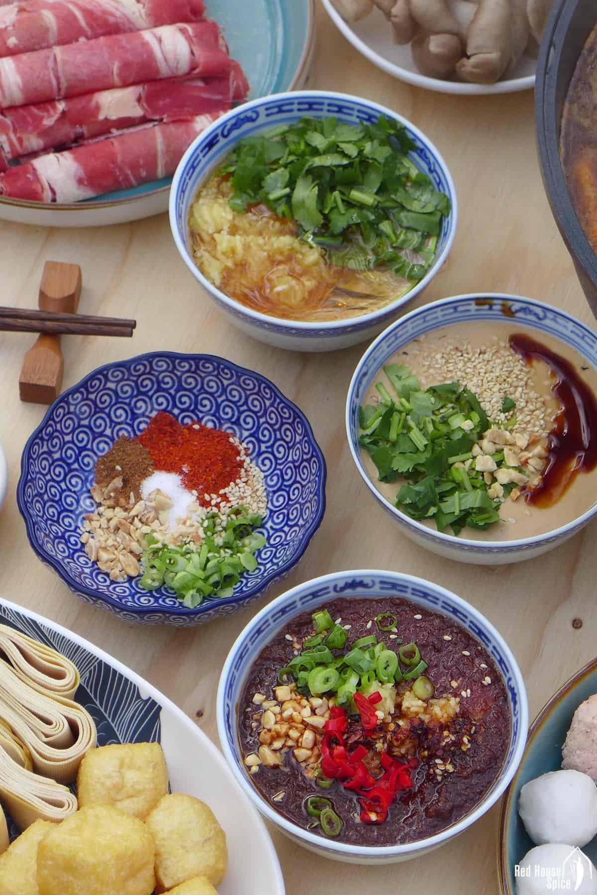 four bowls of hot pot dipping sauce