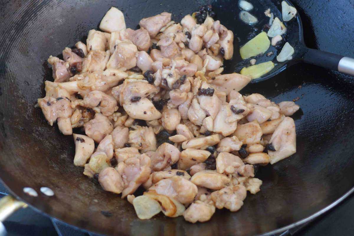 searing chicken with aromatics.