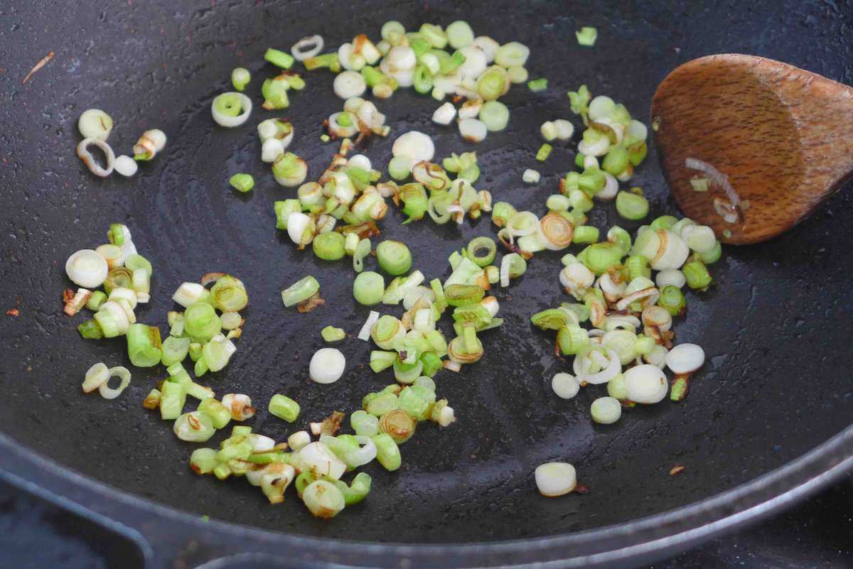 frying chopped scallions.