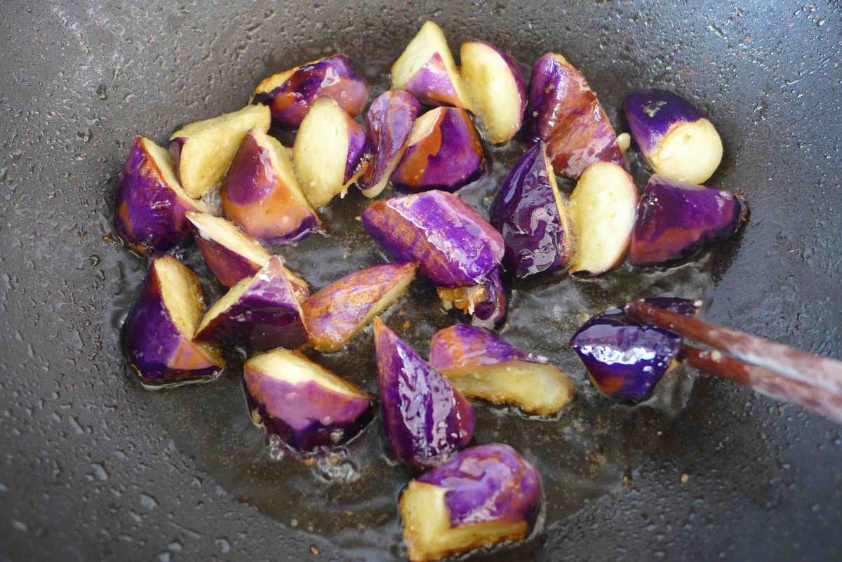 frying eggplant pieces.