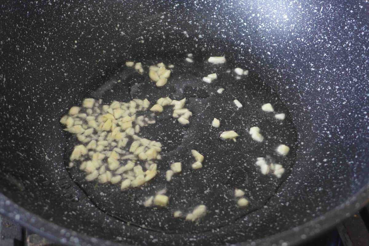 sizzling minced garlic in oil.