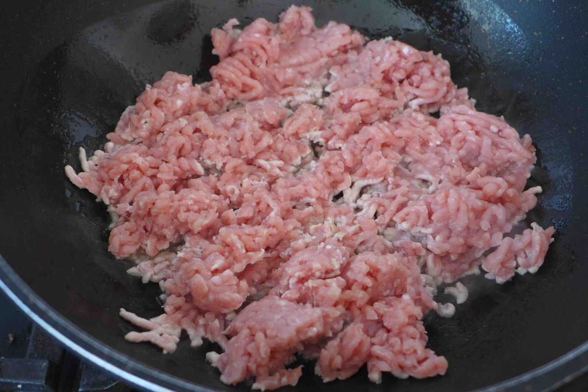 frying ground pork.