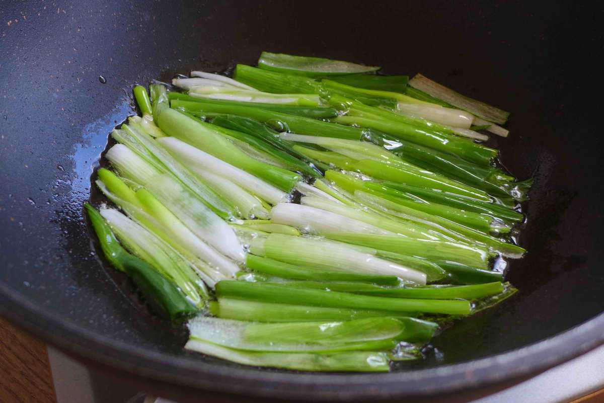 frying scallions in oil.