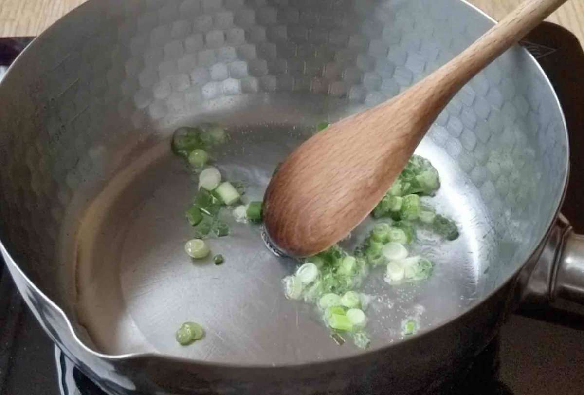frying scallions in oil.