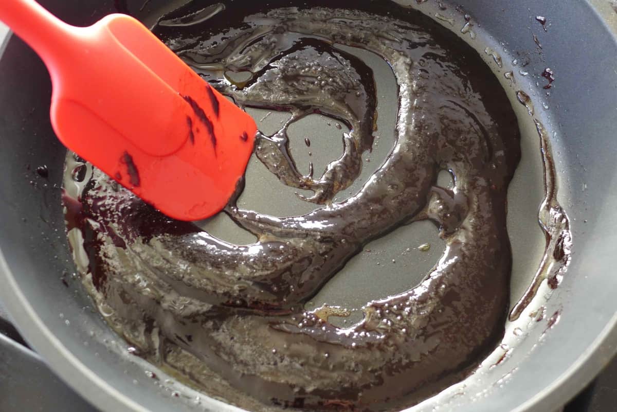 cooking sweet bean sauce in a pan