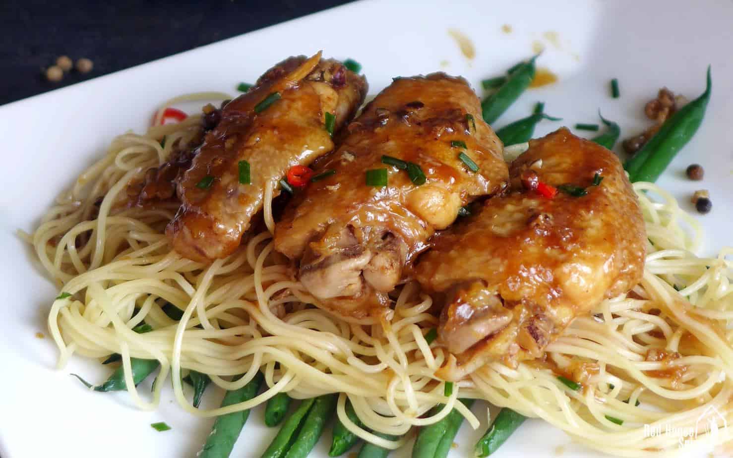Chicken wings on noodles