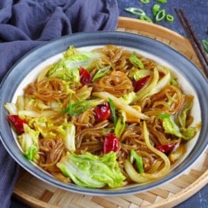 a plate of glass noodles braised with Napa cabbage