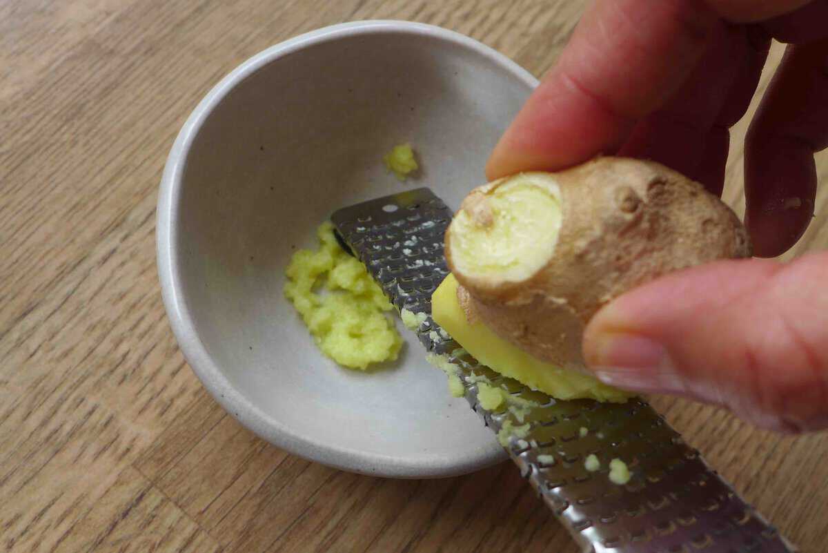 grating ginger.