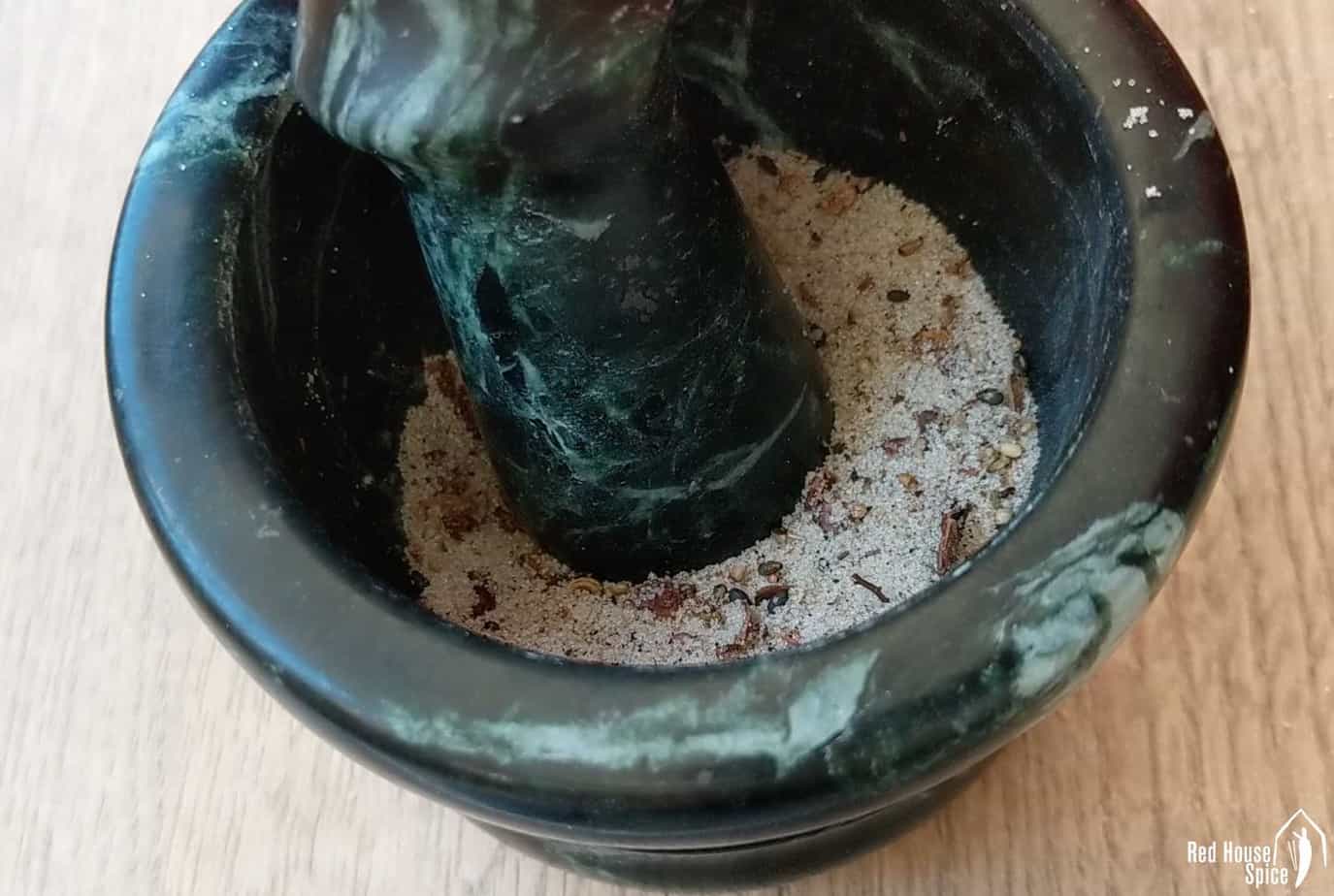 grinding spices in a mortar