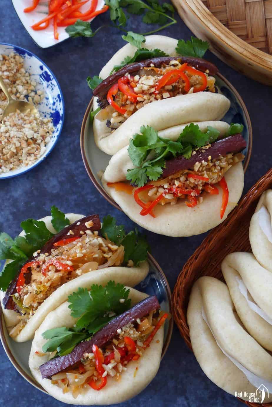 Assembled Gua Bao stuffed with pork belly slices.