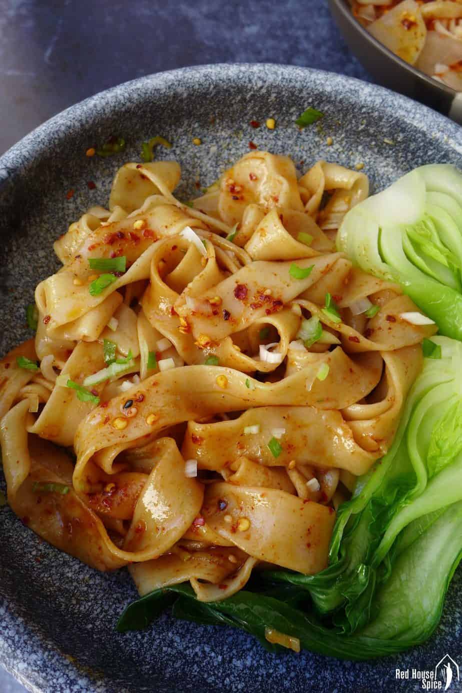 A bowl of Biang Biang noodles using hand-pulled noodles.