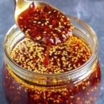 A jar of chili oil with overlay text that says homemade chili oil.