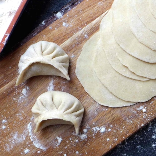 dumpling wrappers and two dumplings
