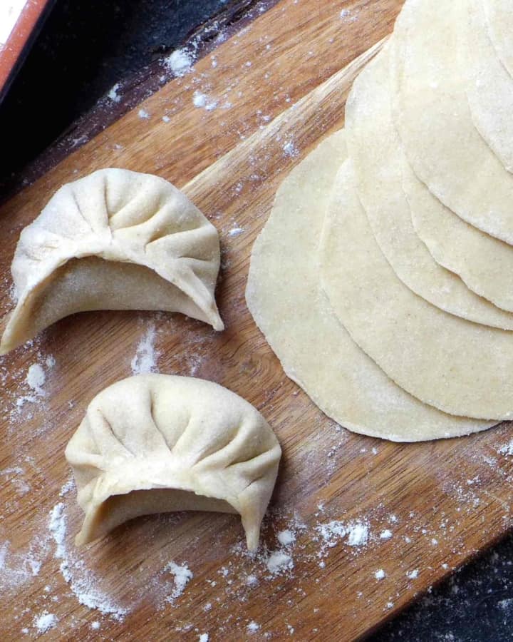 dumpling wrappers and two dumplings