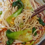 noodles picked up by chopsticks.