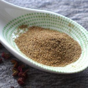 Ground Sichuan pepper in a spoon.