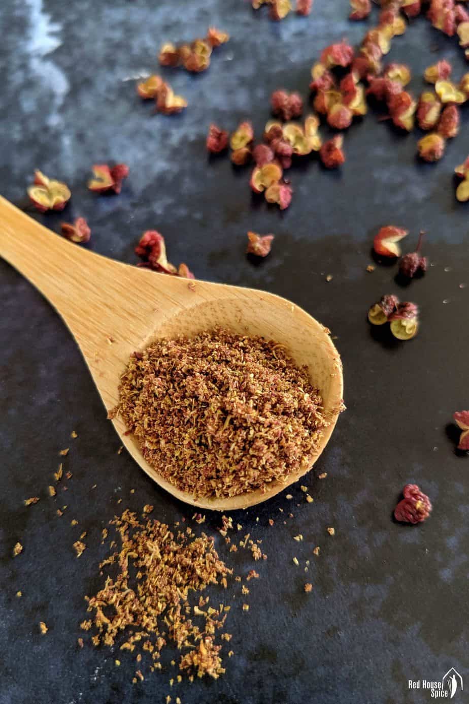 Ground Sichuan pepper in a spoon.