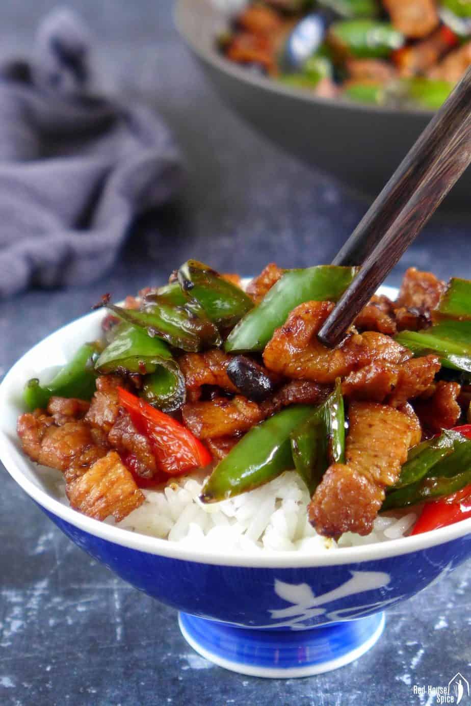 Chopsticks picking up Hunan pork