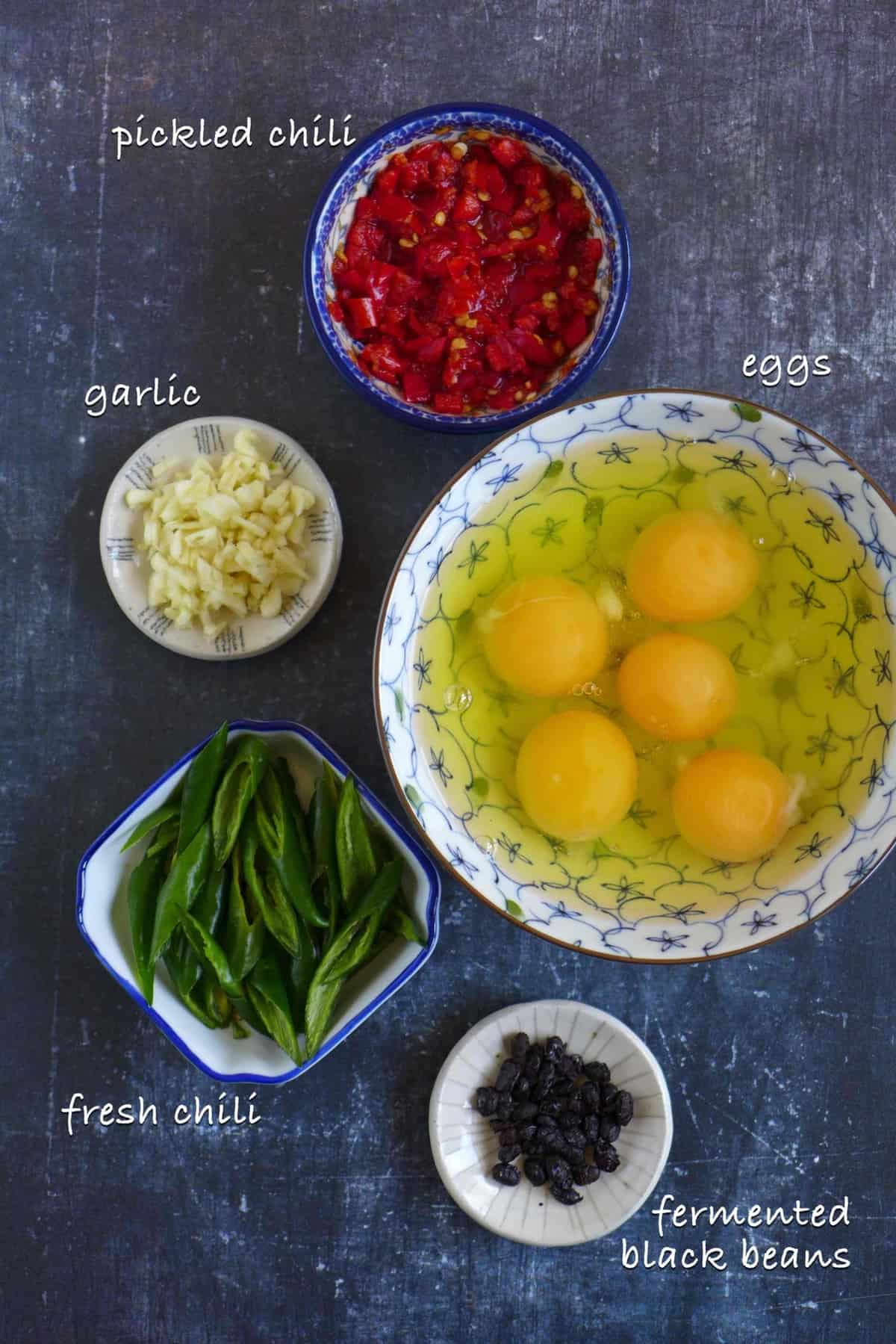 Raw ingredients for making egg and pickled chili stir-fry