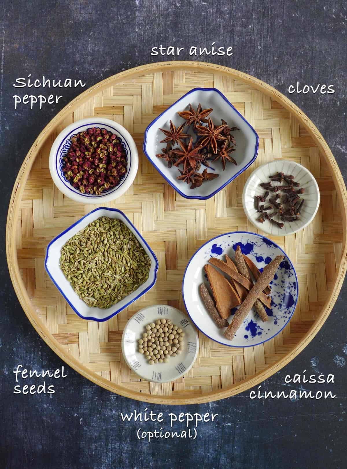 Ingredients for making five spice powder: fennel seeds, star anise, cloves, Sichuan pepper, cassia cinnamon and white pepper.