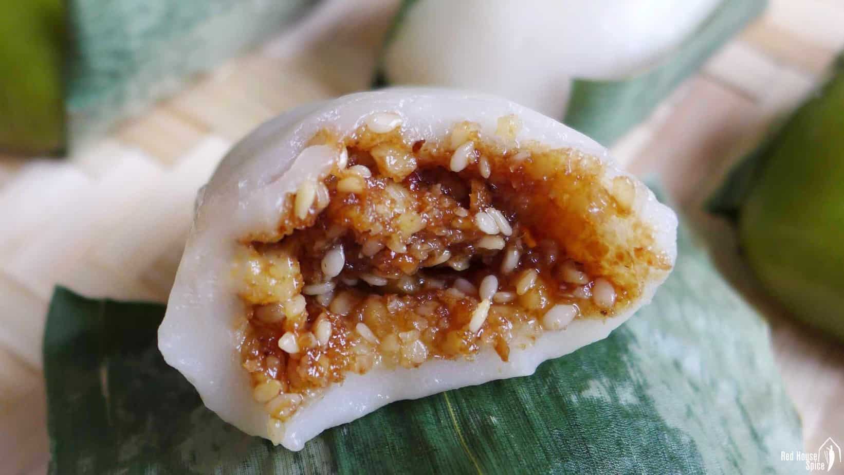 A sticky rice cake filled with walnuts & sesame seeds