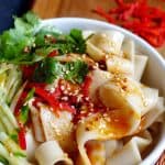 A bowl of Liang pi, Chinese cold skin noodles seasoned with chilli oil, sesame seeds, etc