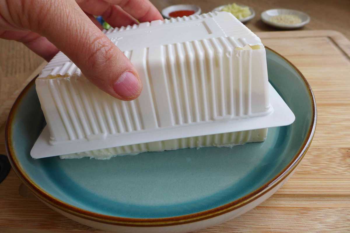lifting a box off a block of silken tofu