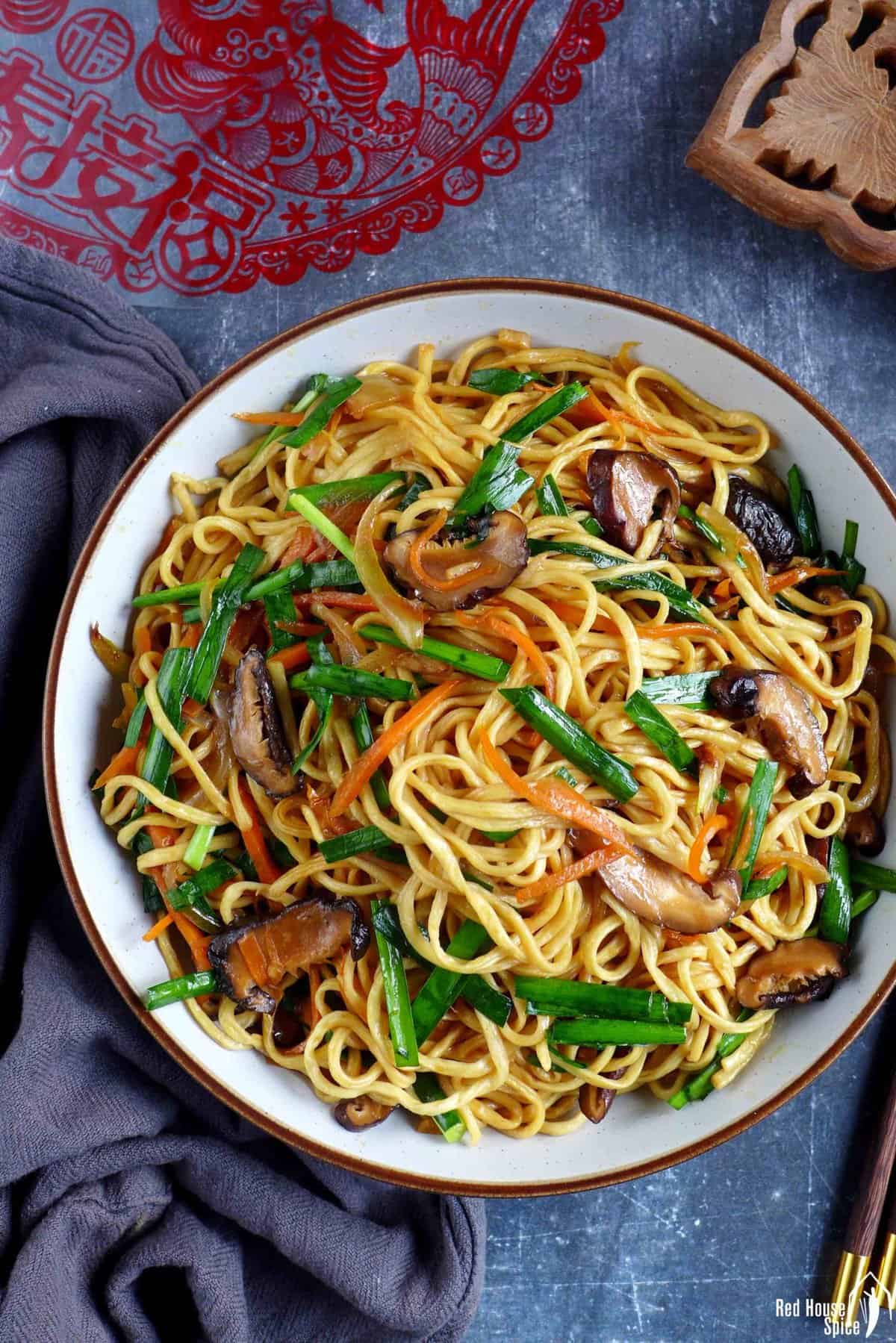 longevity noodles with mushroom, carrot and Chinese chives.