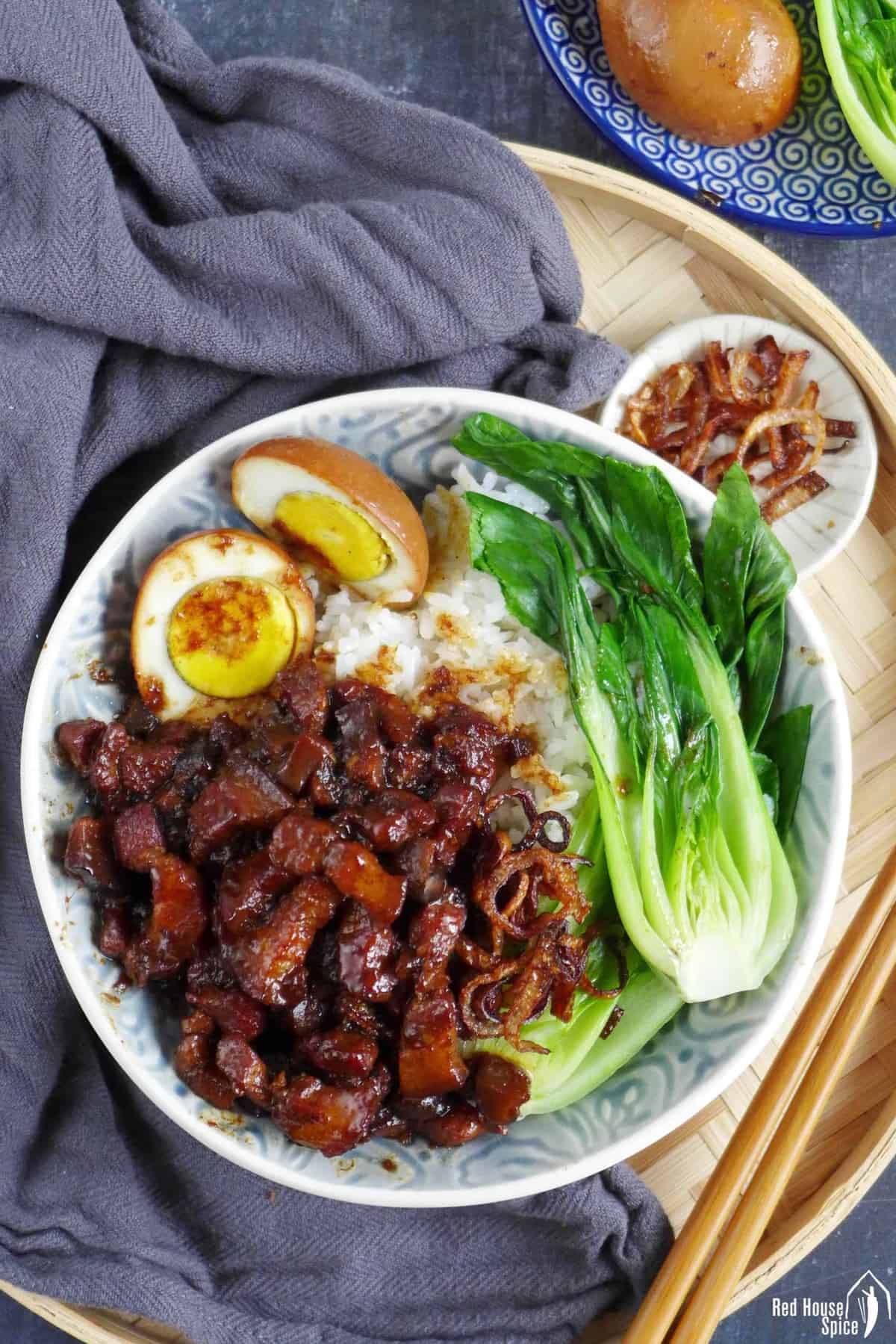 A bowl of Lu Rou Fan with crispy shallots on the side