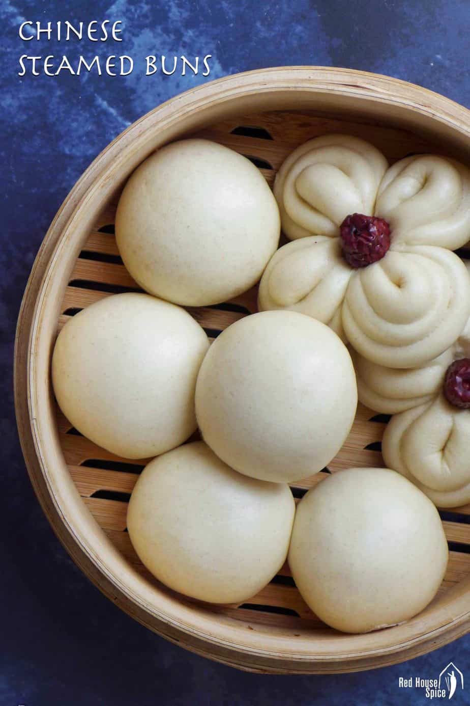 Chinese steamed buns in a bamboo basket.