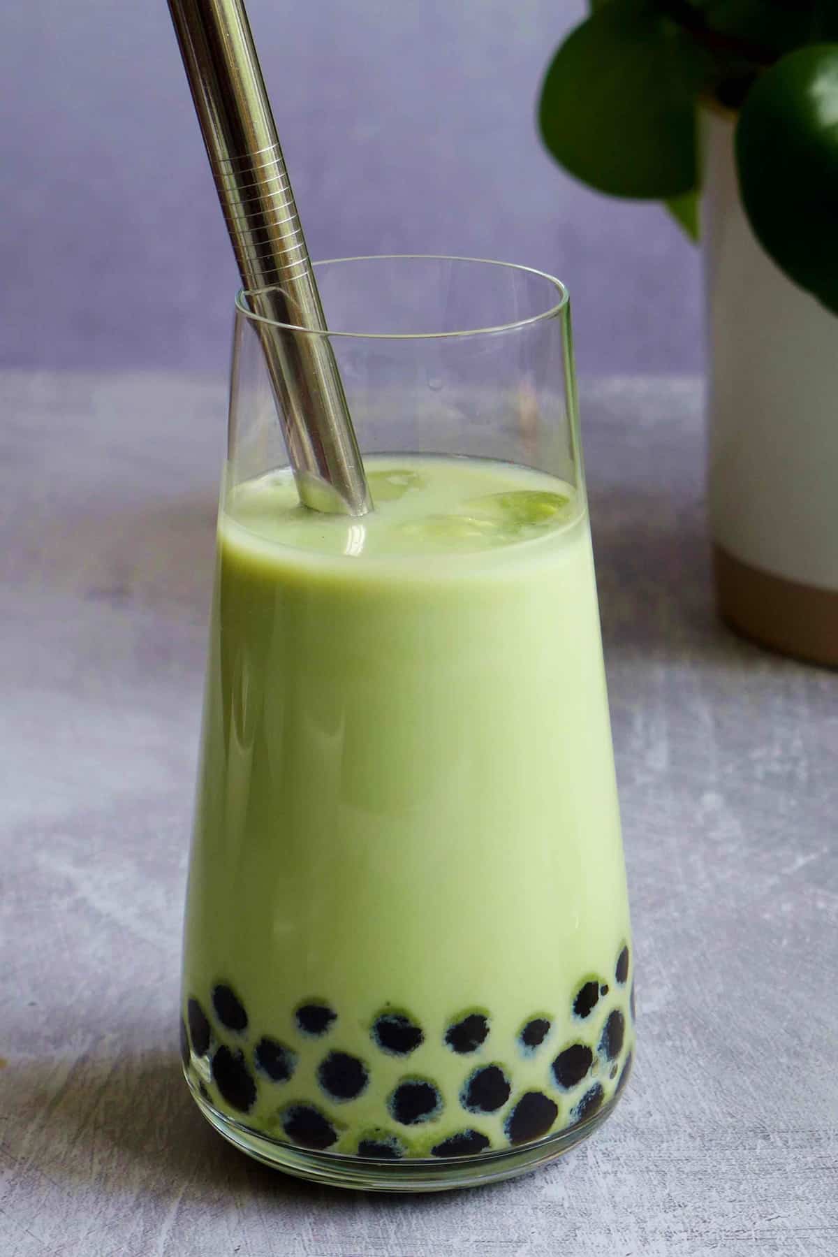 A glass of matcha bubble tea