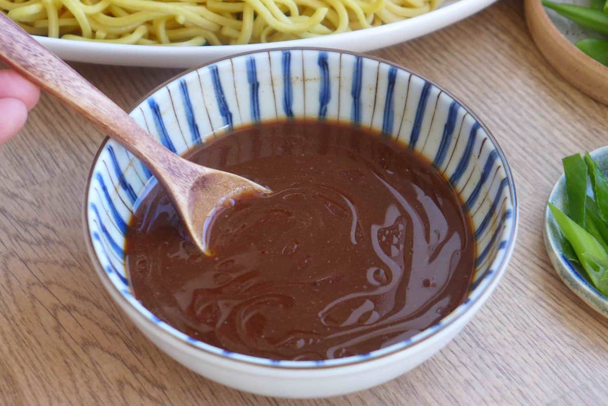 mixing lo mein sauce.