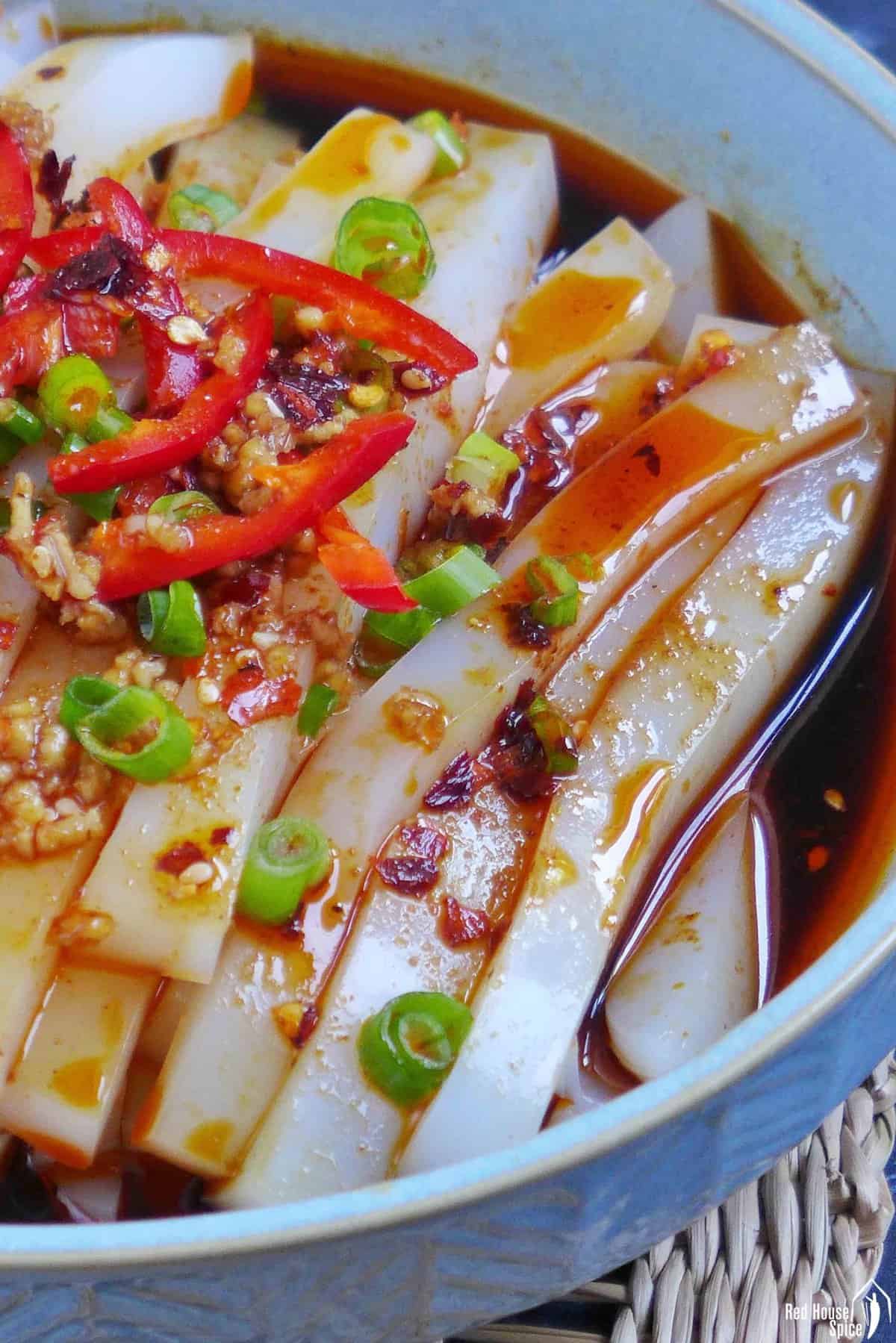 Strands of mung bean jelly in a spicy sauce.