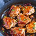6 oyster sauce chicken thighs in a skillet.