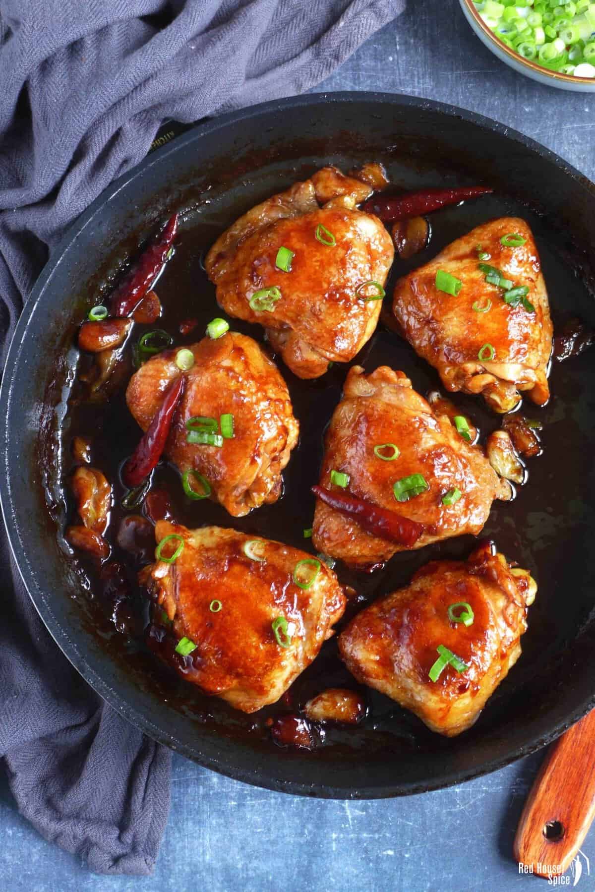 6 oyster sauce chicken thighs in a skillet.