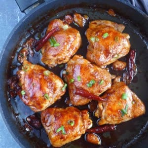 6 oyster sauce chicken thighs in a skillet.