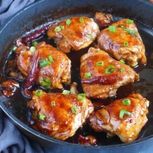 oyster sauce chicken thighs in a skillet.