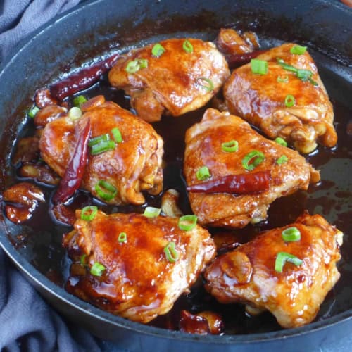 oyster sauce chicken thighs in a skillet.