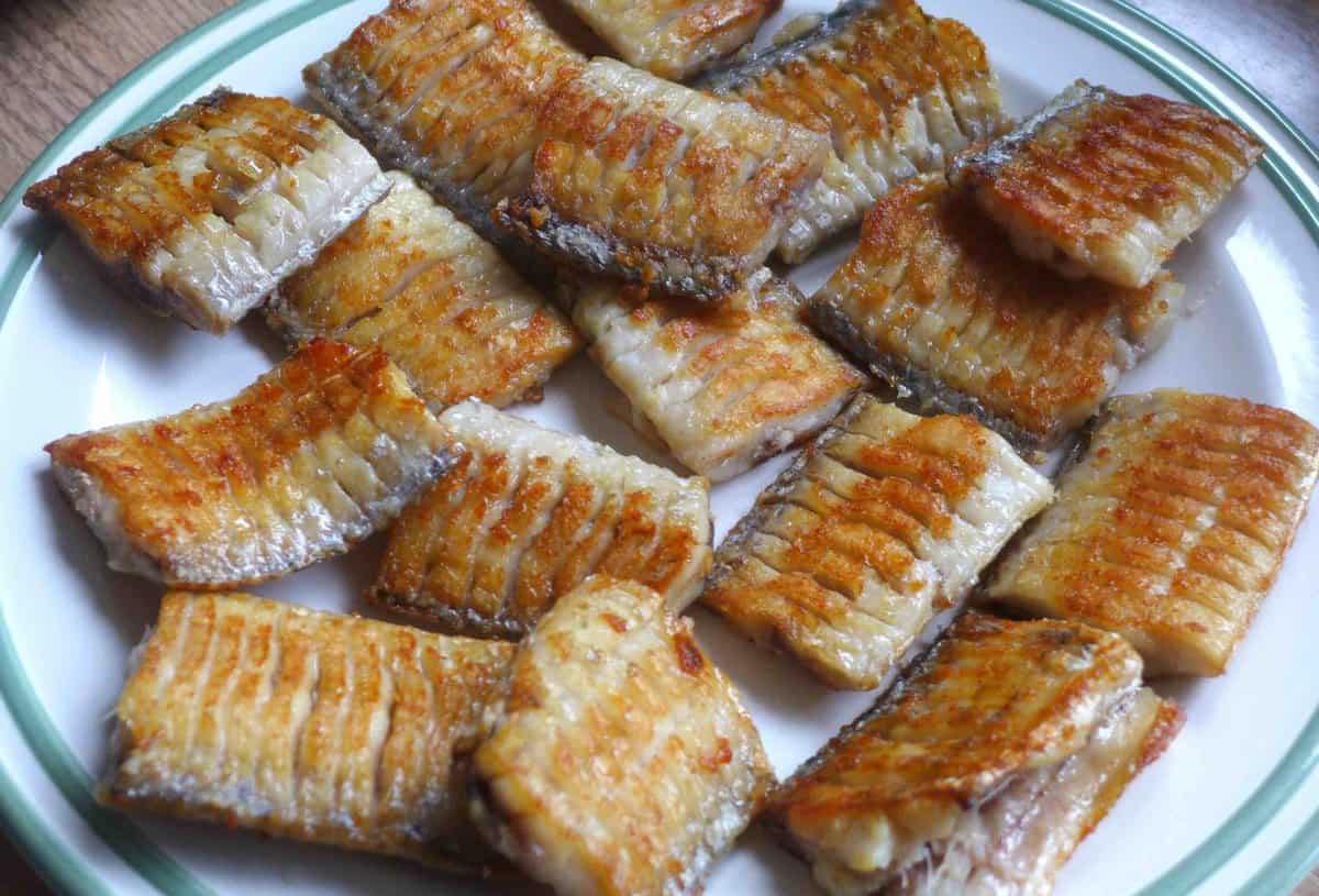 pan-fried belt fish on a plate.