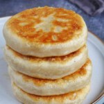 cooked meat pies in a pile.